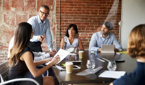 Group of employees working in a conference room