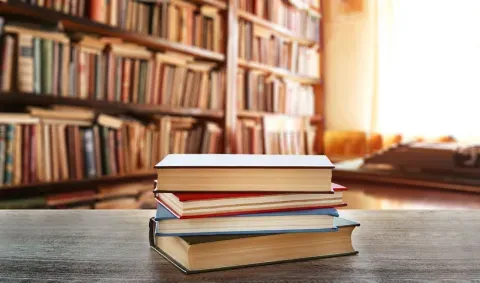 stack of books in a library