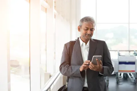 man texting on his phone
