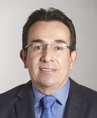 Juan Carlos Santos' headshot