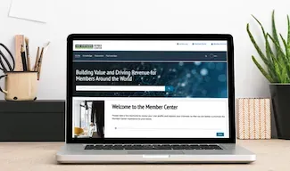 Laptop with Member Center page from Owners.org