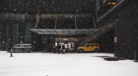 Guests arrive at hotel in snow