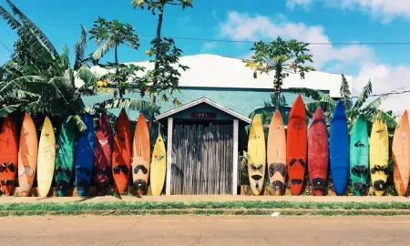 Kayaks lined up on a building's wall